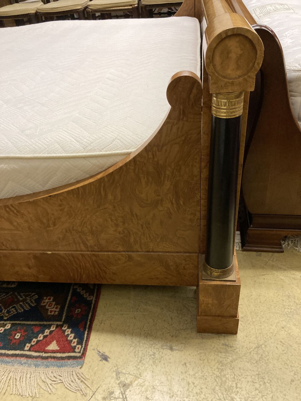 An Empire style birds eye maple gilt metal mounted and part ebonised Superking 6ft. bed frame and mattress